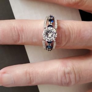 925 Sterling silver with dark blue stones, size 8